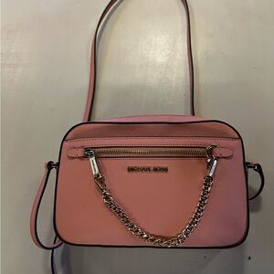 An original Michael Kors purse.  Used only 1 summer.